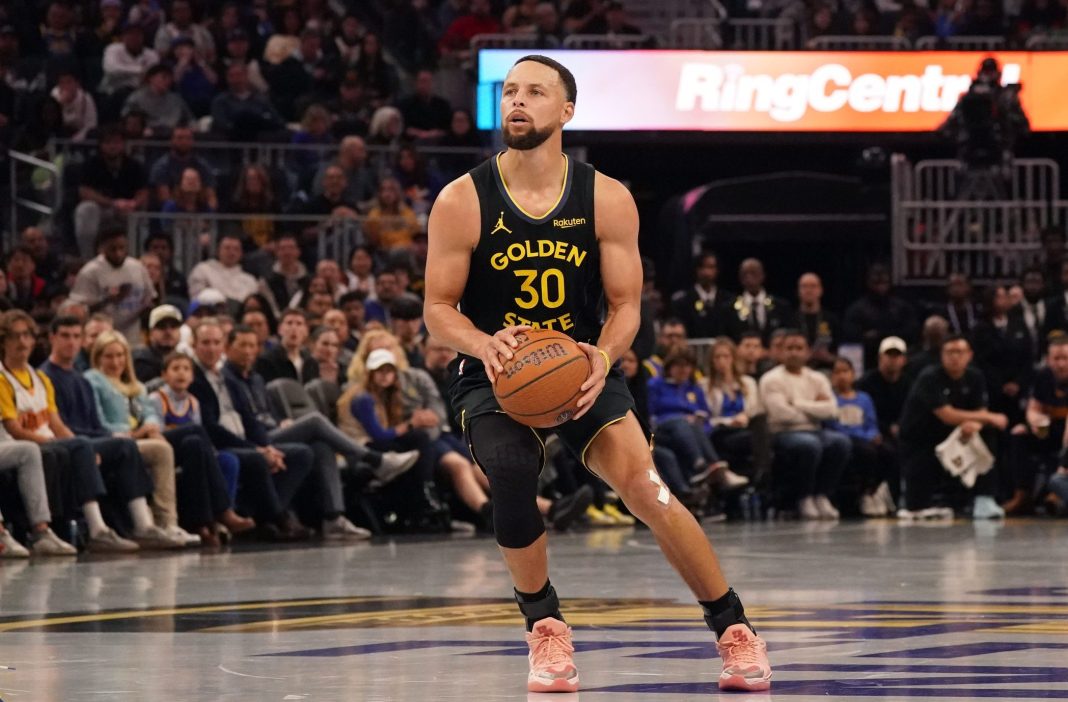 Warriors star Stephen Curry takes a jumper against the Rockets during the 2025-26 NBA season.